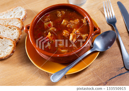 Portion of stewed tripe is cooked in plate - stomach of cattle Portion of stewed tripe is cooked in plate - stomach of cattle 133550915