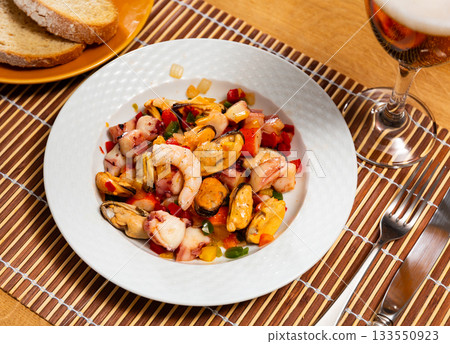 Salad of Spanish cuisine is Seafood Salpicon, made from chopped seafood and vegetables in dressing or sauce Salad of Spanish cuisine is Seafood Salpicon, made from chopped seafood and vegetables in dressing or sauce 133550923