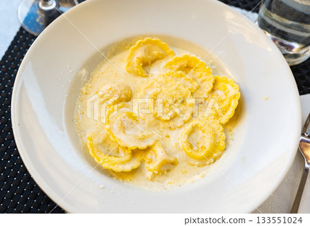 Italian ravioli pasta served with cheese 133551024