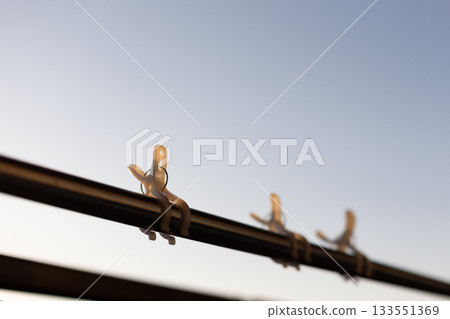 Winter blue sky and clothespins Winter blue sky and clothespins 133551369