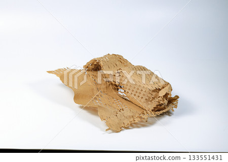 Parcel wrapped in eco-friendly wrapping paper, lightweight bubble wrap for protective packaging, Environmentally friendly Honeycomb paper hexagonal shape made of cardboard recycled craft paper. 133551431