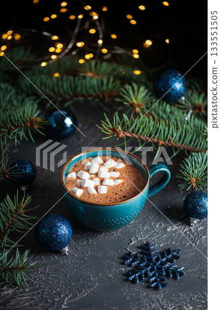 Hot Chocolate with Marshmallows in Teal Mug Surrounded by Christmas Decor Hot Chocolate with Marshmallows in Teal Mug Surrounded by Christmas Decor 133551505