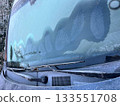 Car windshield covered with frost, heated glass 133551708