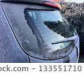 Frost-covered rear window of a car 133551710