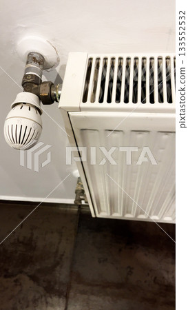 Radiator battery for heating an apartment with a temperature sensor.  133552532