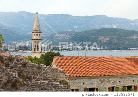Church of St. John the Baptist and distant boats on the bay of Budva, Montenegro Church of St. John the Baptist and distant boats on the bay of Budva, Montenegro 133552571