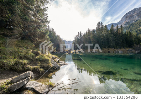 Summer time at romantic forest Lake Obernberg scenic mountain lakes landscape in Austria, Tyrol Summer time at romantic forest Lake Obernberg scenic mountain lakes landscape in Austria, Tyrol 133554296