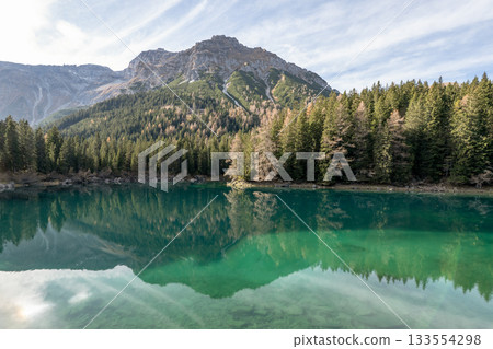 Summer time at romantic forest Lake Obernberg scenic mountain lakes landscape in Austria, Tyrol Summer time at romantic forest Lake Obernberg scenic mountain lakes landscape in Austria, Tyrol 133554298