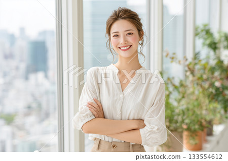 Professional photo of a woman working in a clean office 133554612