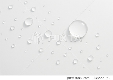 A clean background of transparent water droplets lined up on a white background A clean background of transparent water droplets lined up on a white background 133554959