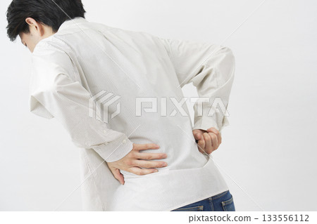 Male back pain white background 133556112