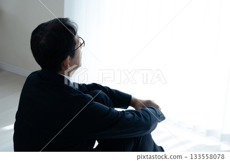 Depressed middle-aged businessman 133558078