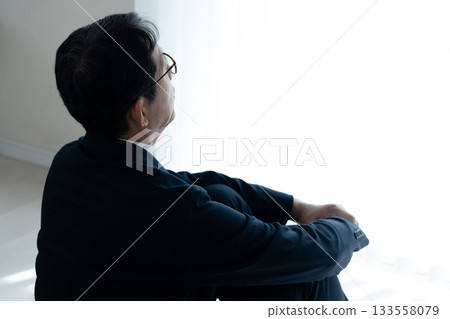 Depressed middle-aged businessman 133558079