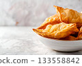 Crispy Fried Dumplings in a White Bowl are a delightful comfort food choice with a delicious taste 133558842