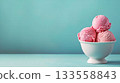 A delightful and attractive display of Pink Strawberry Ice Cream Scoops served in a White Bowl 133558843