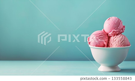 A delightful and attractive display of Pink Strawberry Ice Cream Scoops served in a White Bowl 133558843