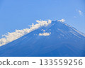 Snow covered Mt. Fuji that shines in the blue sky Snow covered Mt. Fuji that shines in the blue sky 133559256