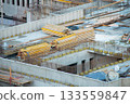 Warehouse of Yellow Volumetric I-Beams for Formwork on Roof of Monolithic Building Box. Fittings are braided at Construction Site and Thermal Pads are embedded in Roof Parapet. 133559847