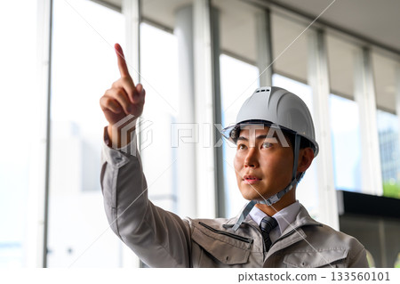 Management inspection of men in work clothes Management inspection of men in work clothes 133560101