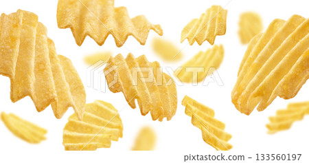 Fluted potato chips levitate on a white background Fluted potato chips levitate on a white background 133560197