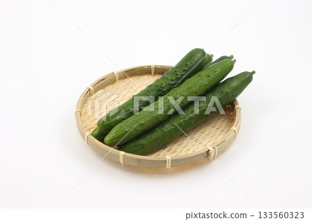 The fresh, vibrant cucumbers, harvested early in the morning, retain their vitality and refreshing taste. The fresh, vibrant cucumbers, harvested early in the morning, retain their vitality and refreshing taste. 133560323