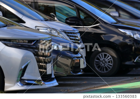 Passenger cars lining up in the parking lot Passenger cars lining up in the parking lot 133560383