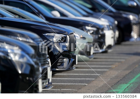 Passenger cars lining up in the parking lot Passenger cars lining up in the parking lot 133560384