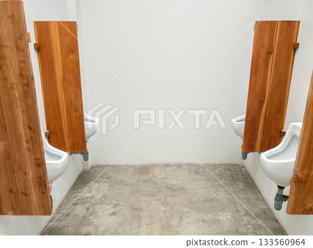 Modern men's urinals with wooden privacy panels Modern men's urinals with wooden privacy panels 133560964