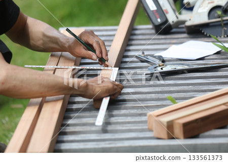 A man marking timber A man marking timber 133561373