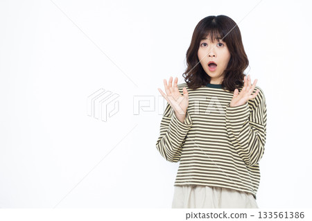 Surprised and amazed woman 133561386