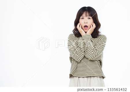 Surprised and amazed woman 133561432