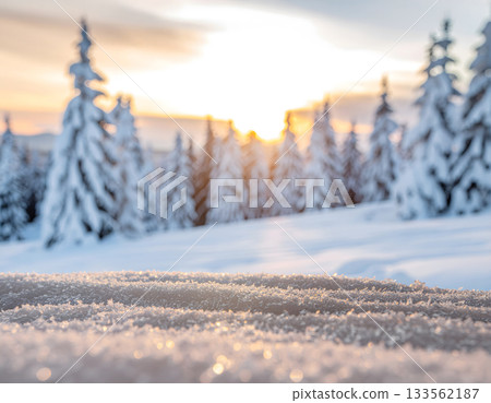 Close-up of Snow Crystals with Blurred Winter Forest Sunset 133562187