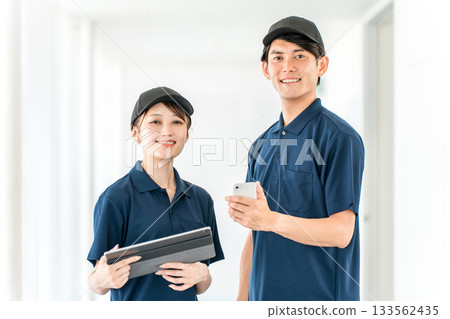 Male and female staff of transportation and delivery companies wearing polo shirt uniforms, drivers 133562435