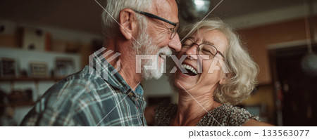 Happy senior couple elderly man elderly woman laugh smile affection close up candid indoor warm light celebrate love Happy senior couple elderly man elderly woman laugh smile affection close up candid indoor warm light celebrate love 133563077