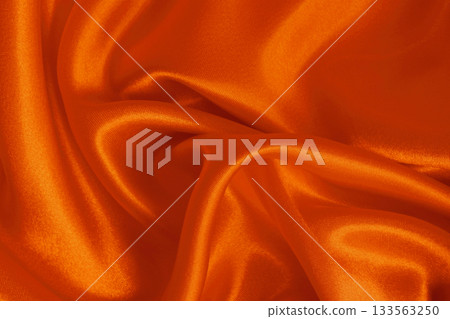 Orange fabric cloth texture for background and design art work, beautiful crumpled pattern of silk or linen. 133563250