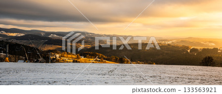 Panoramic view of winter mountain landscape in the evening. Paseky nad Jizerou, Giant Mountains, Czech Republuc Panoramic view of winter mountain landscape in the evening. Paseky nad Jizerou, Giant Mountains, Czech Republuc 133563921