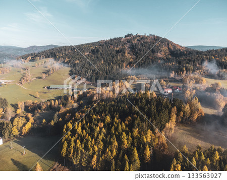 Colorful autumn landscape with Tanvaldsky Spicak Mountain in Jizera Mountains, Czech Republic 133563927