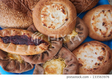 Lots of pies close-up, top view Lots of pies close-up, top view 133563976
