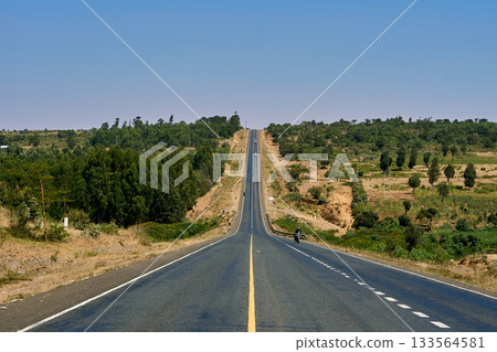 Kenya's roads and land stretching straight under the blue sky Kenya's roads and land stretching straight under the blue sky 133564581