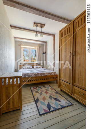 Bright Wooden Bedroom Interior with Cozy Double Bed Bright Wooden Bedroom Interior with Cozy Double Bed 133565118