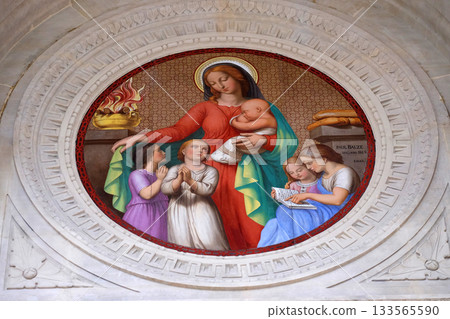 Medallion of the portal represents Charity, Saint Augustine church in Paris, France Medallion of the portal represents Charity, Saint Augustine church in Paris, France 133565590