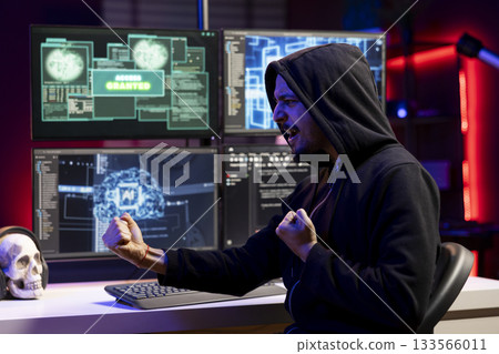 Happy rogue software developer getting access granted message after using AI malware undetectable by antivirus. Jolly hacker celebrates breaching firewall security using data mining script 133566011
