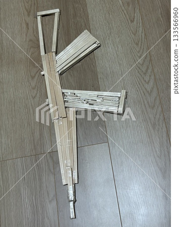 "Handmade rifle model made from disposable chopsticks - DIY craft project" "Handmade rifle model made from disposable chopsticks - DIY craft project" 133566960
