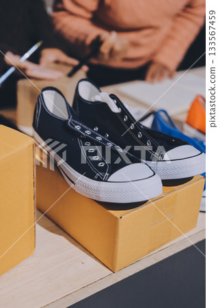 Asian woman describe selling clothes on camera live broadcast on social network at home, Online selling clothes on social media. Blogger woman influencer, SME retail store owner. 133567459