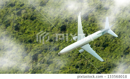 Aerial view of an airplane flying over the clouds with a lush tropical landscape. Concept of travel Aerial view of an airplane flying over the clouds with a lush tropical landscape. Concept of travel 133568018
