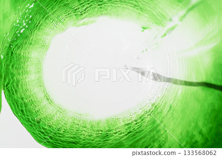 Abstract freshness green colored liquid surface. Circular wave shape. Water with ripples 133568062