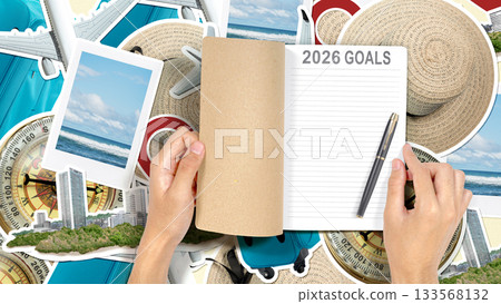 Human hand opening a notebook with the 2026 Goals with a travel theme background. Happy New Year concept or Celebration. Travel goals Human hand opening a notebook with the 2026 Goals with a travel theme background. Happy New Year concept or Celebration. Travel goals 133568132