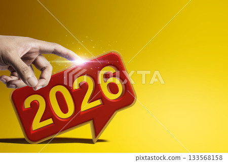 Human hand touches a speech bubble of the year 2026 on a colored background. Happy New Year concept or Celebration 133568158
