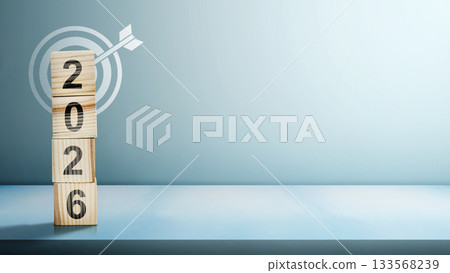 Stack of wooden cubes with the number 2026 with an arrow on a target board on a white background. Happy New Year concept or Celebration. 2026 Goal Target 133568239