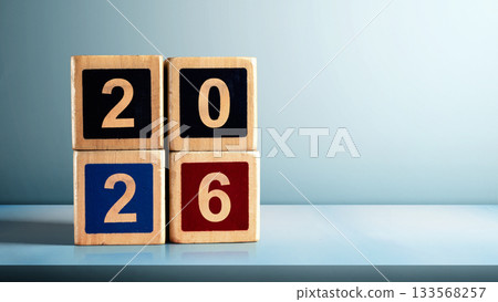 Stack of wooden cubes with the number 2026 on the table with a colored background. Happy New Year concept or Celebration Stack of wooden cubes with the number 2026 on the table with a colored background. Happy New Year concept or Celebration 133568257